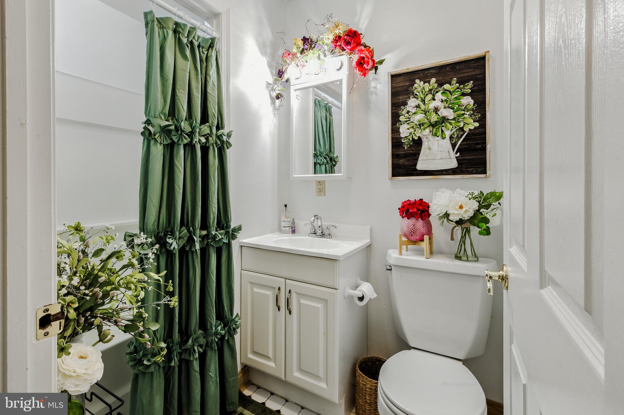 112 Hammonton Buena, NJ 08310 - Photo 30 of 34 a bathroom with a toilet sink and mirror