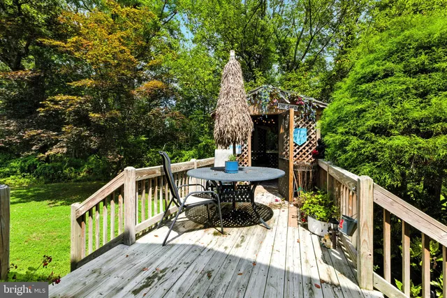 a view of a table and chairs on the roof deck