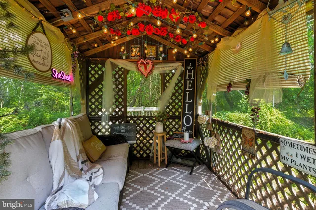 a view of a chairs and tables in the balcony
