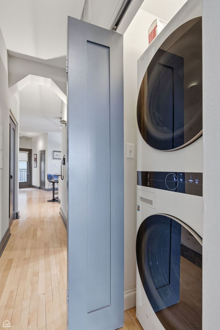 120 West Oak Street, Unit 4D Chicago, IL 60610 - Photo 13 of 18 a view of a hallway with washer and dryer