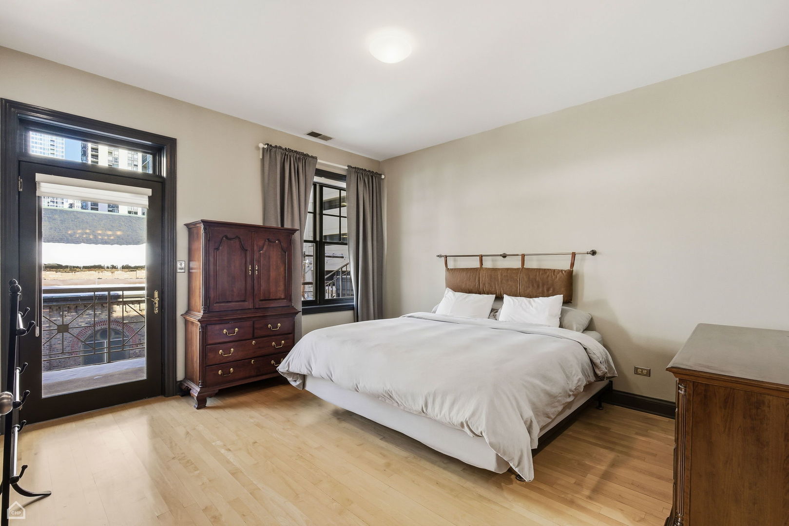 120 West Oak Street, Unit 4D Chicago, IL 60610 - Photo 7 of 18 a bedroom with a bed and large window