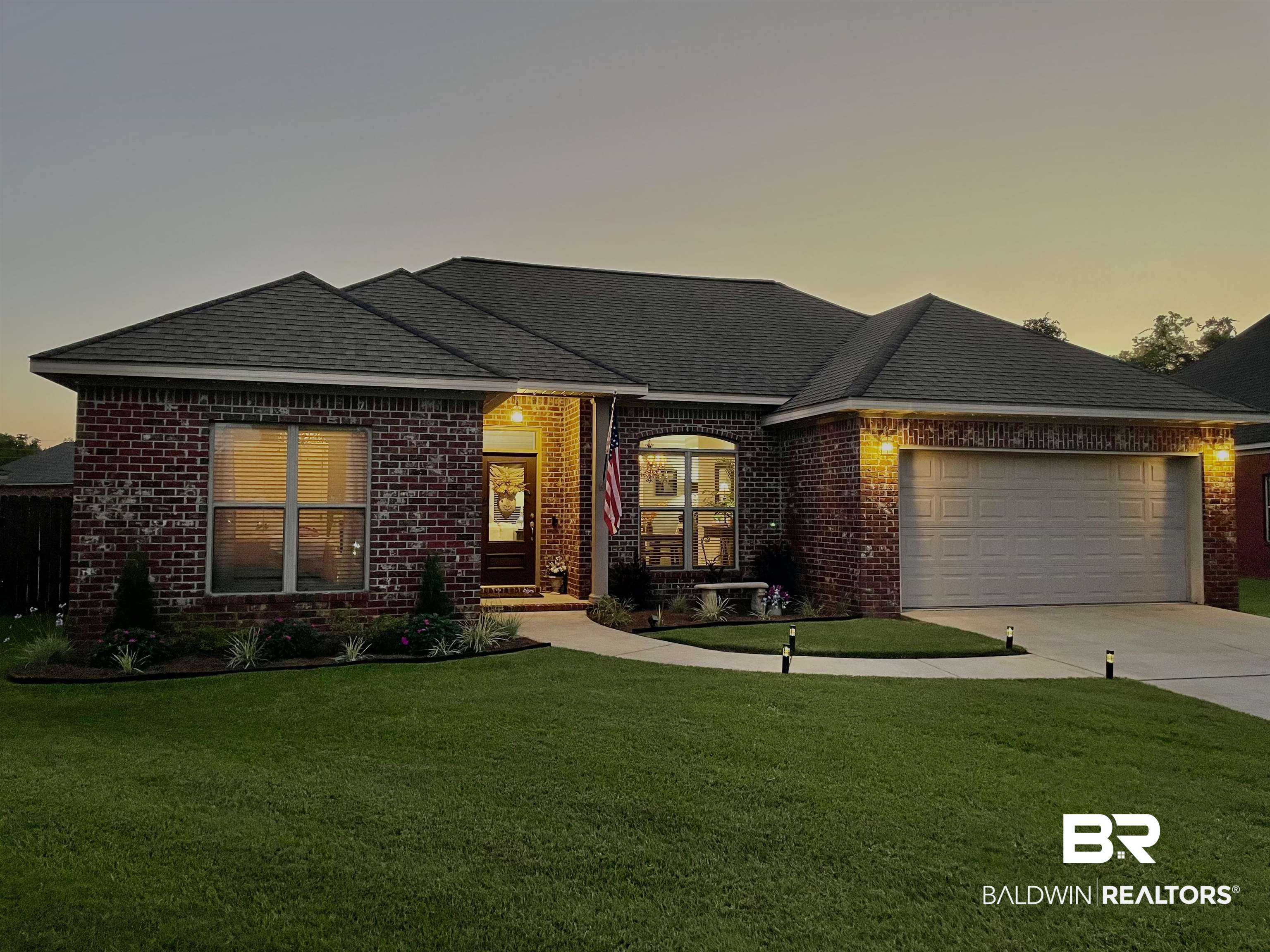 9376 Sable Court Daphne, AL 36526 - Photo 42 of 46 View of front of home featuring a garage and a yard