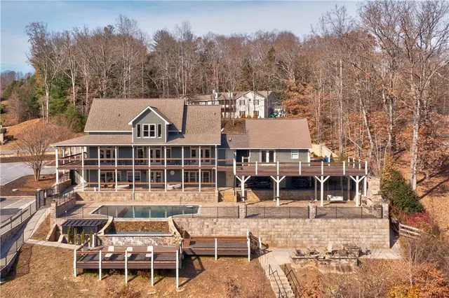 aerial view of a house with a yard and balcony