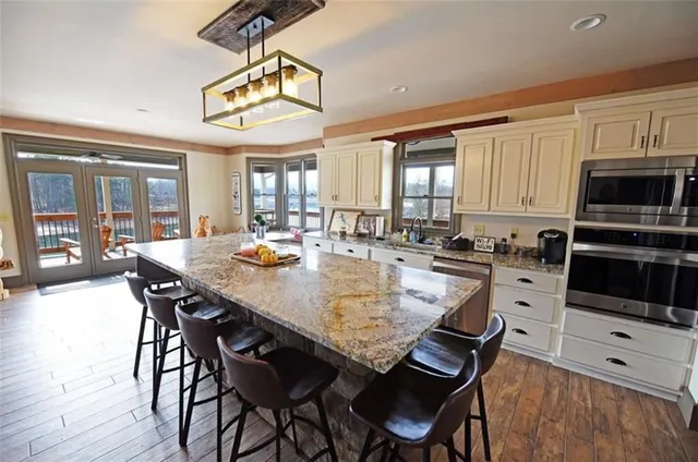 a dining table with chairs and wooden floor