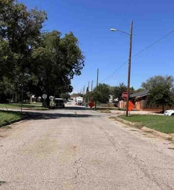 801 Thomas Street Sweetwater, TX 79556 - Photo 4 of 4 a view of a house with a big yard and palm trees