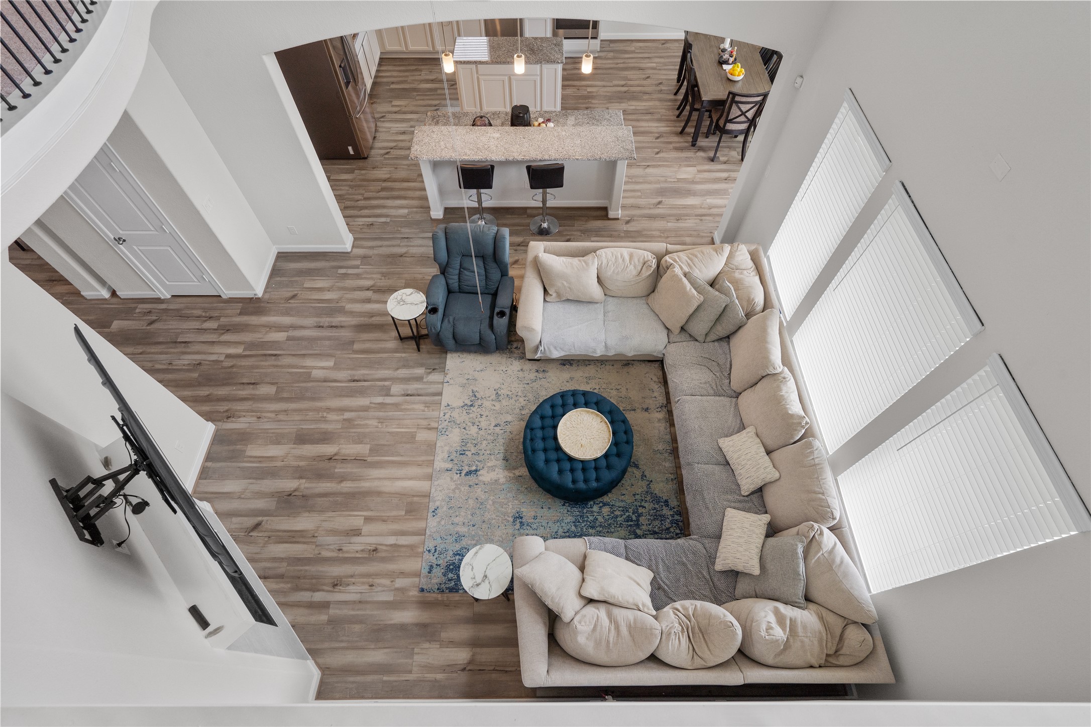 130 Wild Pecan Loop Buda, TX 78610 - Photo 12 of 31 Open-concept living area with wood-finish flooring throughout