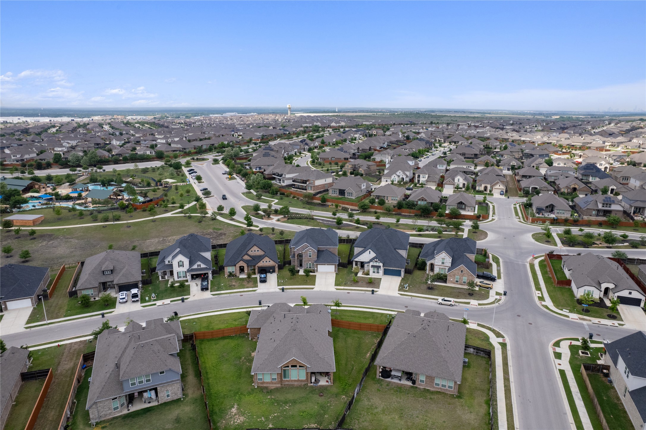 130 Wild Pecan Loop Buda, TX 78610 - Photo 31 of 31 Aerial perspective showcasing a residential development with numerous single-family homes
