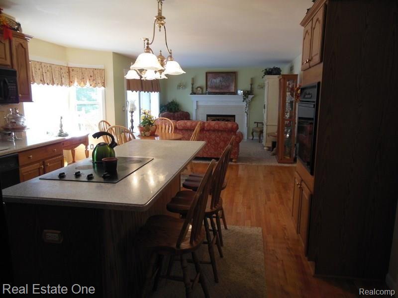 10155 Roberts Road Gregory, MI 48137 - Photo 23 of 89 Built ins, cook top, over, microwave and dishwasher. Large island