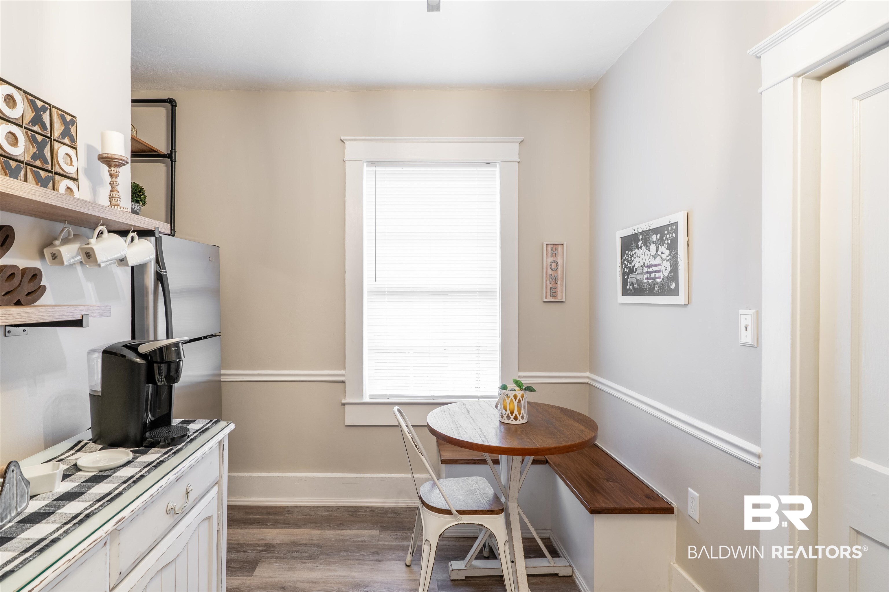 1600 Government Street, Unit 3F Mobile, AL 36604 - Photo 16 of 18 Dining room featuring wood finished floors, baseboards, and breakfast area