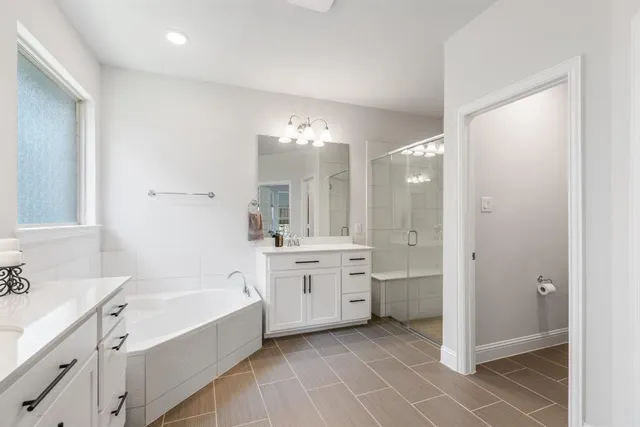 a living room with furniture and a book shelf