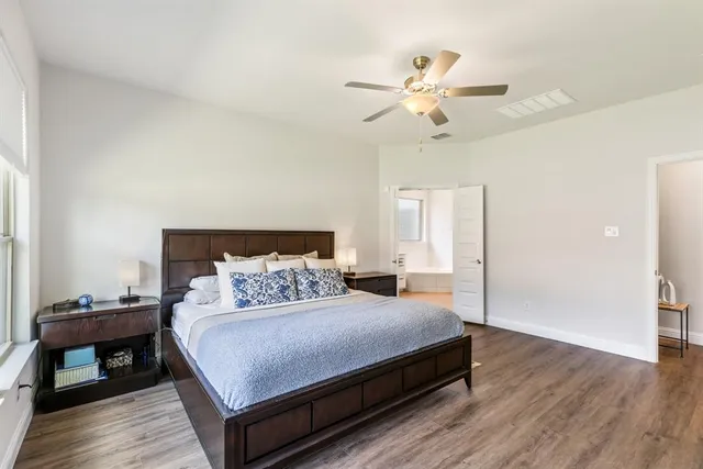 a bathroom with a tub sink shower and mirror