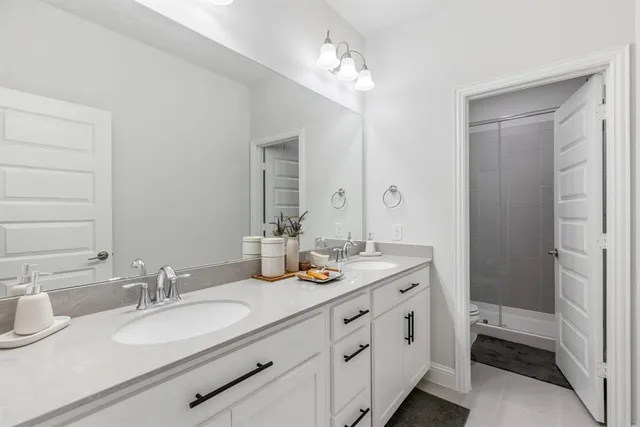 a bedroom with a large bed and a large window