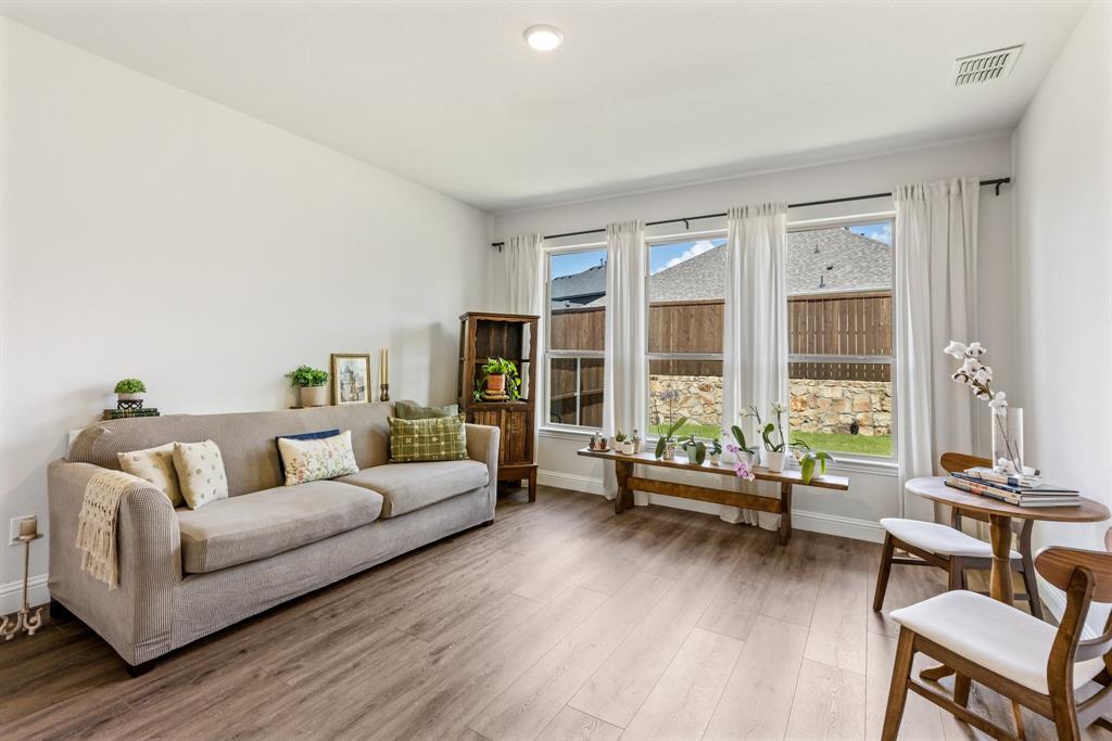 313 Savannah Lane Oak Point, TX 75068 - Photo 15 of 39 Living area featuring light wood-type flooring and baseboards