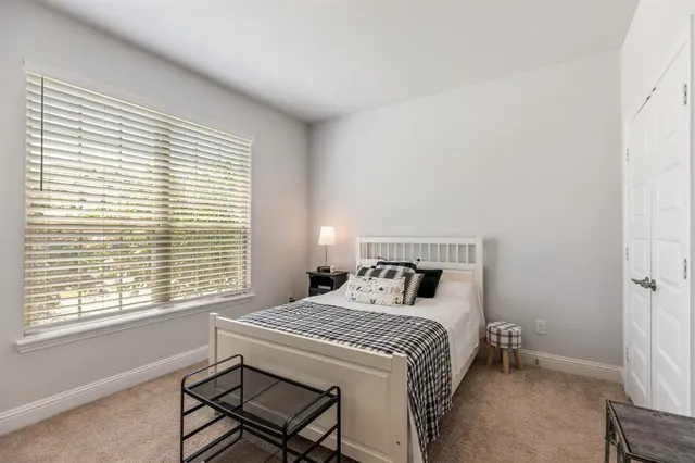 a bathroom with double sink and a mirror