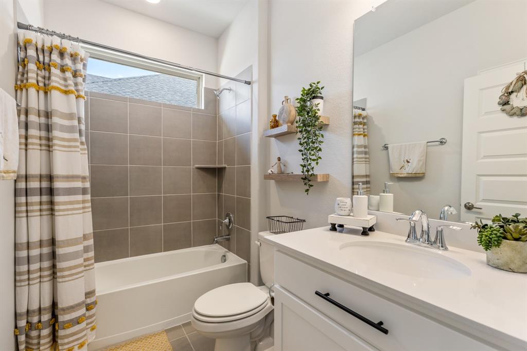 313 Savannah Lane Oak Point, TX 75068 - Photo 17 of 39 Full bathroom featuring shower / bath combination with curtain, vanity, and light tile patterned floors