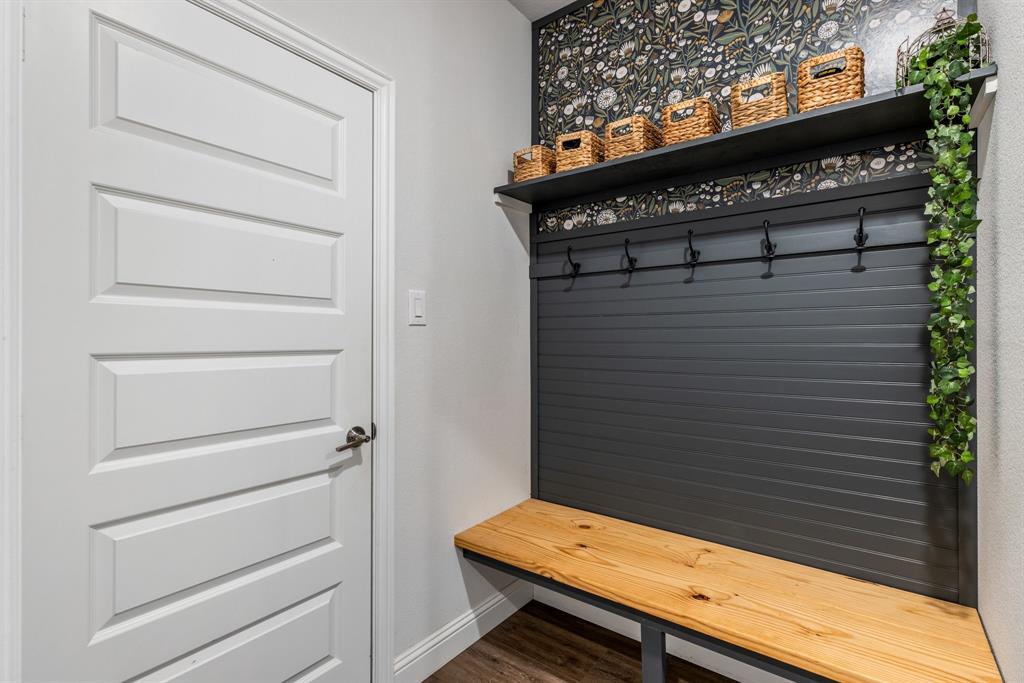 313 Savannah Lane Oak Point, TX 75068 - Photo 18 of 39 Mudroom featuring baseboards and dark wood-type flooring
