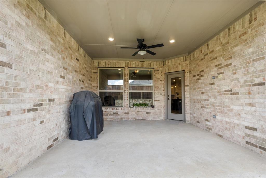 313 Savannah Lane Oak Point, TX 75068 - Photo 21 of 39 View of patio / terrace with a ceiling fan and a grill