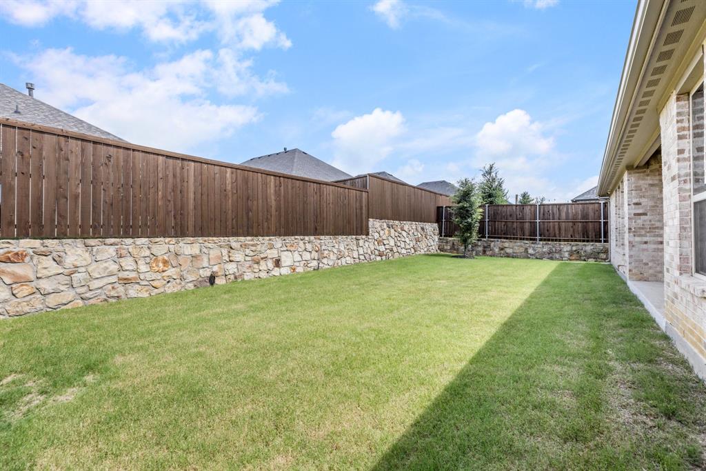 313 Savannah Lane Oak Point, TX 75068 - Photo 23 of 39 View of fenced backyard
