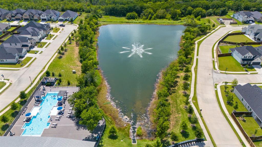 313 Savannah Lane Oak Point, TX 75068 - Photo 31 of 39 Aerial perspective of suburban area featuring a nearby body of water
