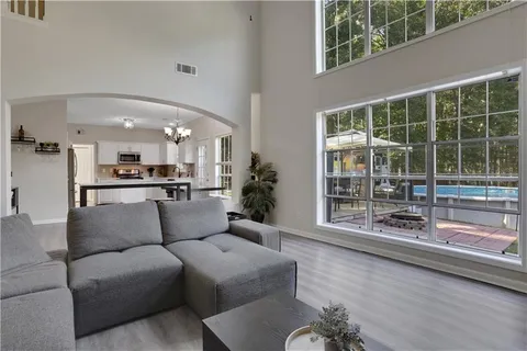 a living room with furniture and a large window