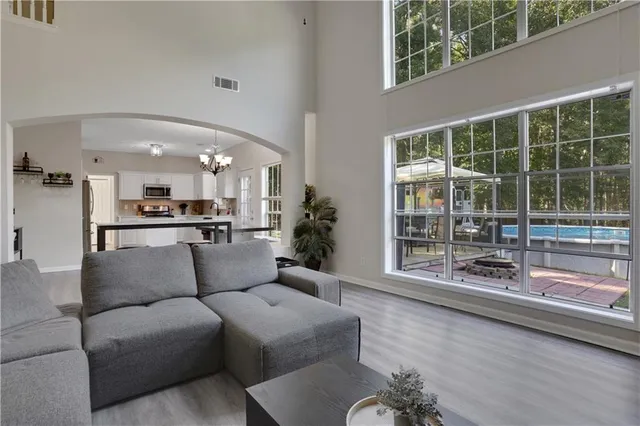 a living room with furniture and a large window