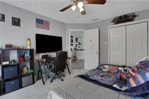 a view of a livingroom with furniture and a flat screen tv