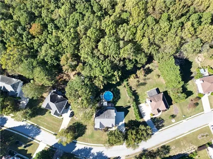 an aerial view of house with yard