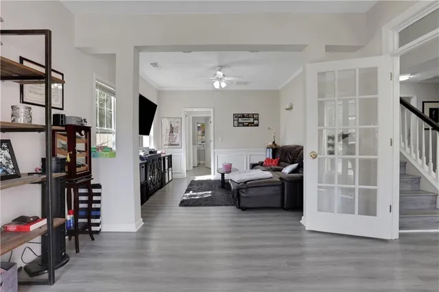a living room with furniture and a flat screen tv