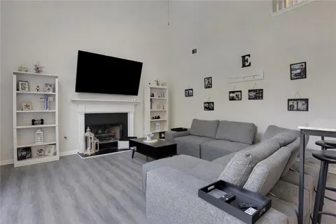 a living room with furniture or fireplace and a flat screen tv
