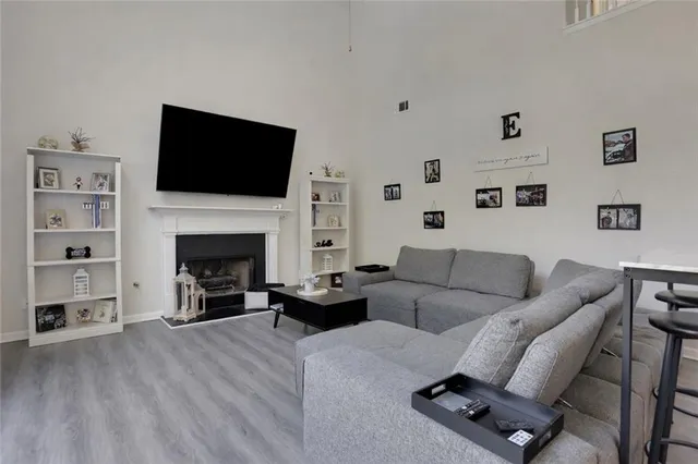 a living room with furniture or fireplace and a flat screen tv