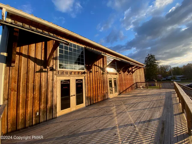 a view of a house with large windows