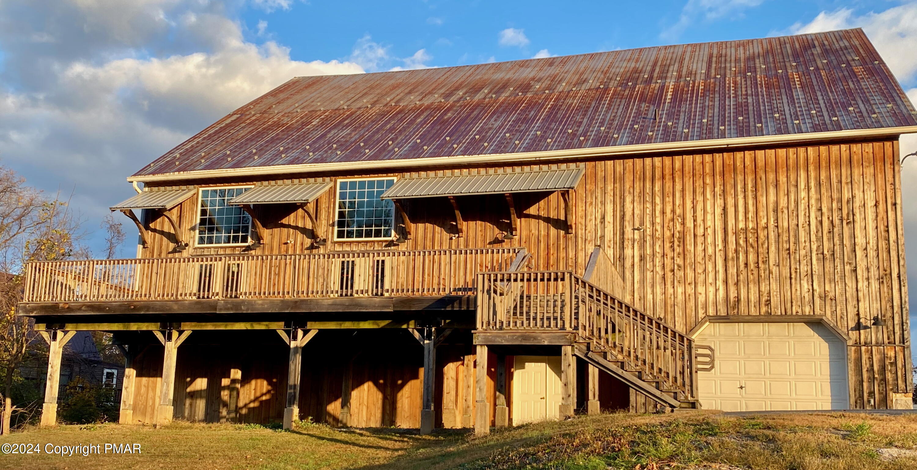 10491 River Road New Columbia, PA 17856 - Photo 15 of 72 a view of a house with large windows
