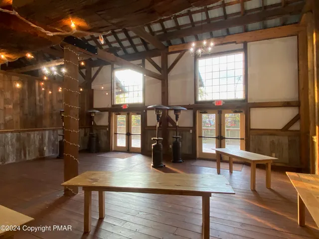 a view of a swimming pool with outdoor seating