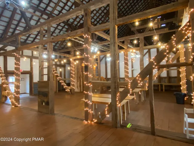 a view of a kitchen with dining room and chairs