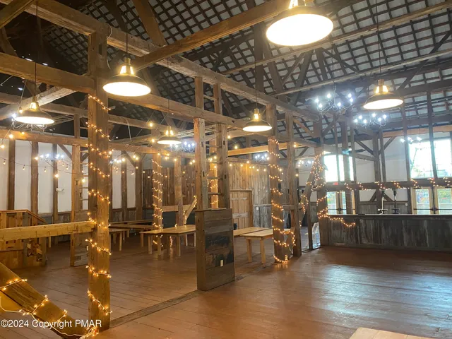a gym room with lots of chairs and a chandelier