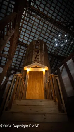 a living room with furniture a fireplace and a window