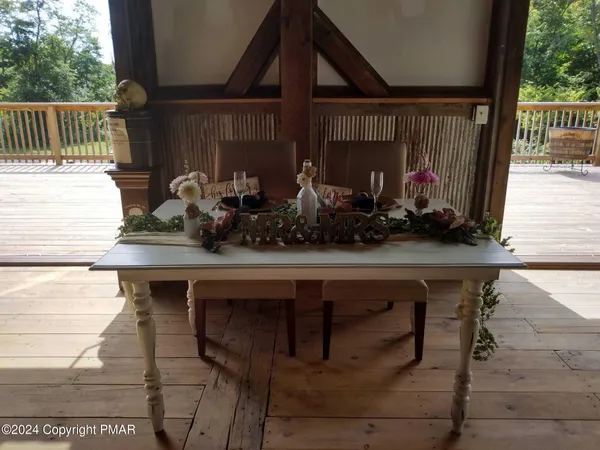 a living room with furniture a couch and a chandelier