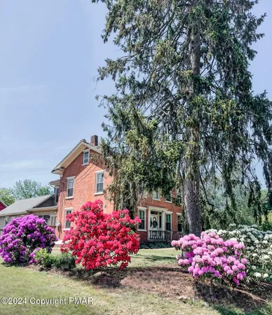 a bathroom with a sink a mirror and shower