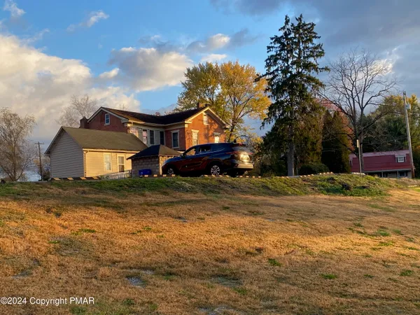 a room with windows and wooden floor