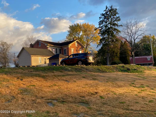 a room with windows and wooden floor