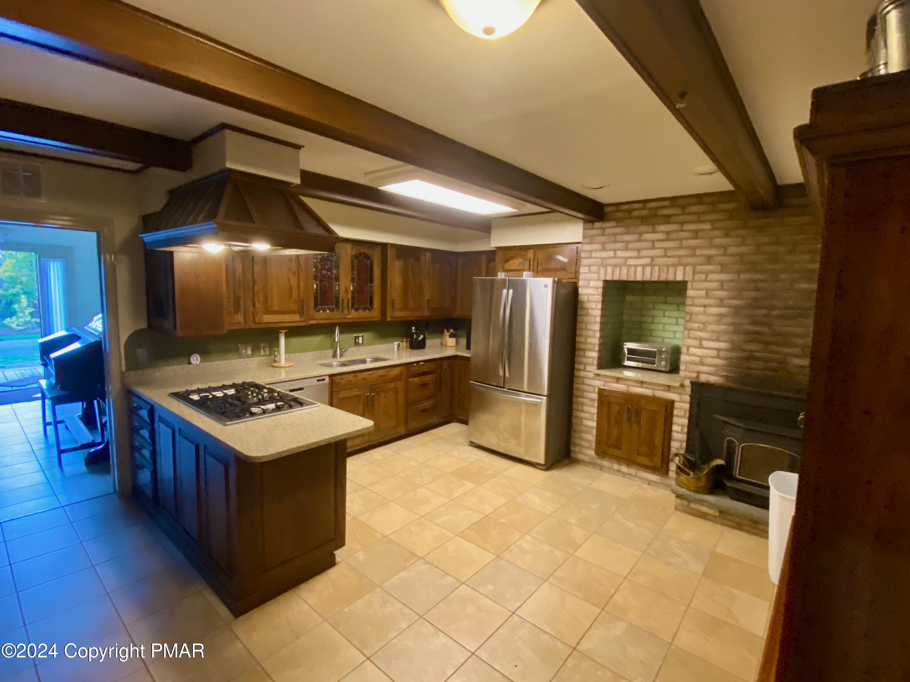10491 River Road New Columbia, PA 17856 - Photo 48 of 72 a kitchen with granite countertop a sink a counter top space stainless steel appliances and cabinets