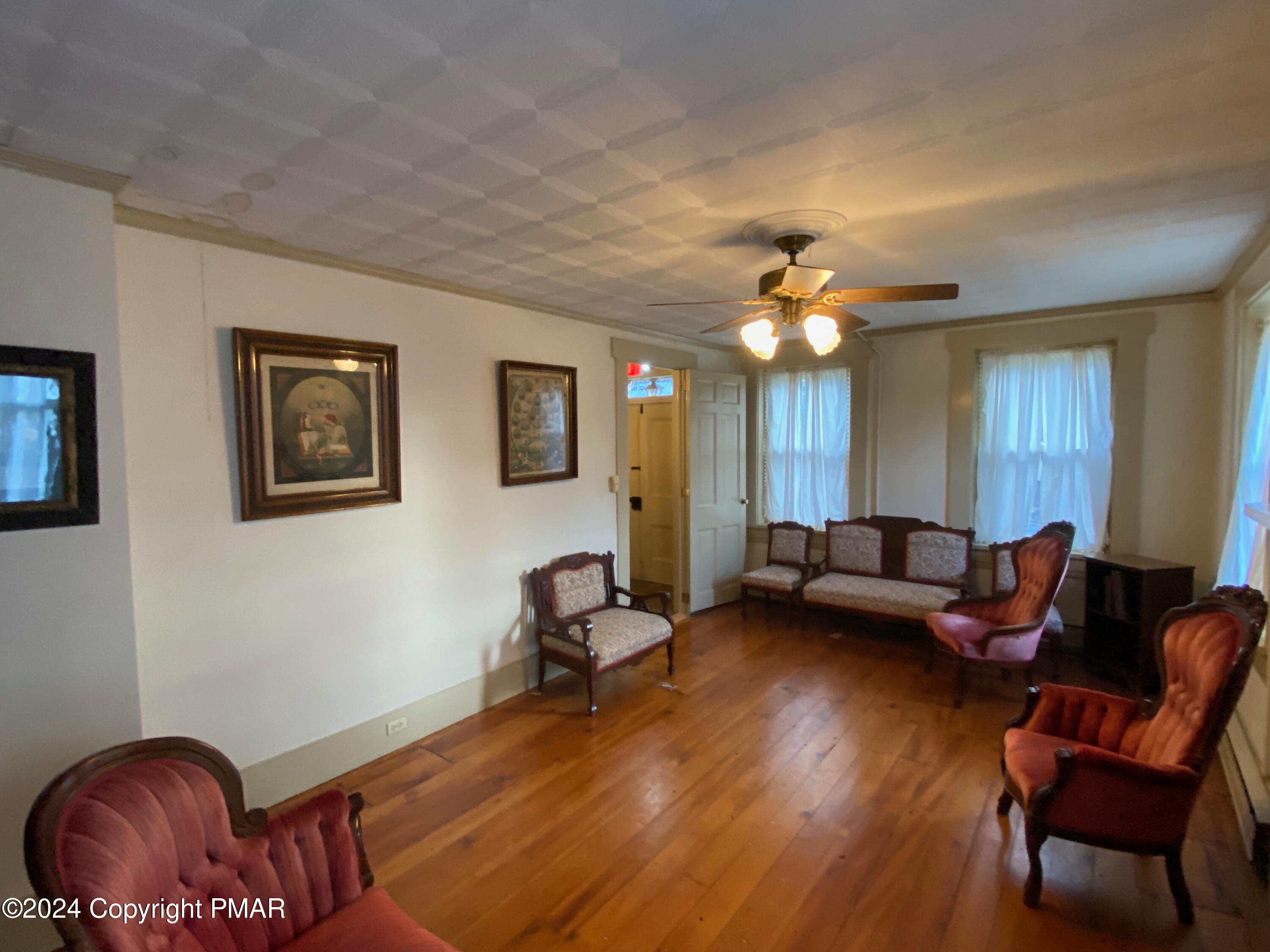 10491 River Road New Columbia, PA 17856 - Photo 54 of 72 a living room with furniture a couch and a chandelier