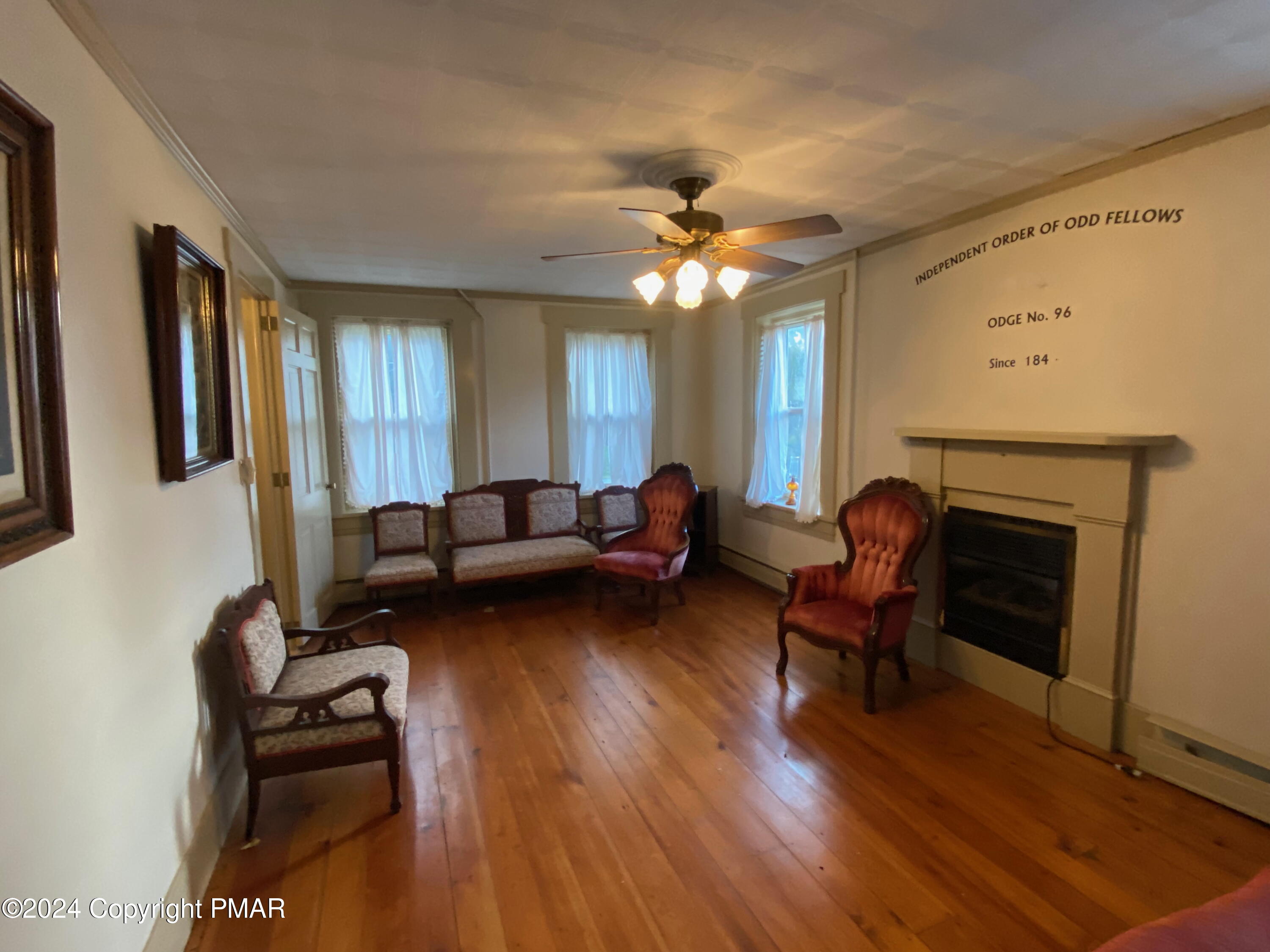 10491 River Road New Columbia, PA 17856 - Photo 55 of 72 a living room with furniture and a fireplace