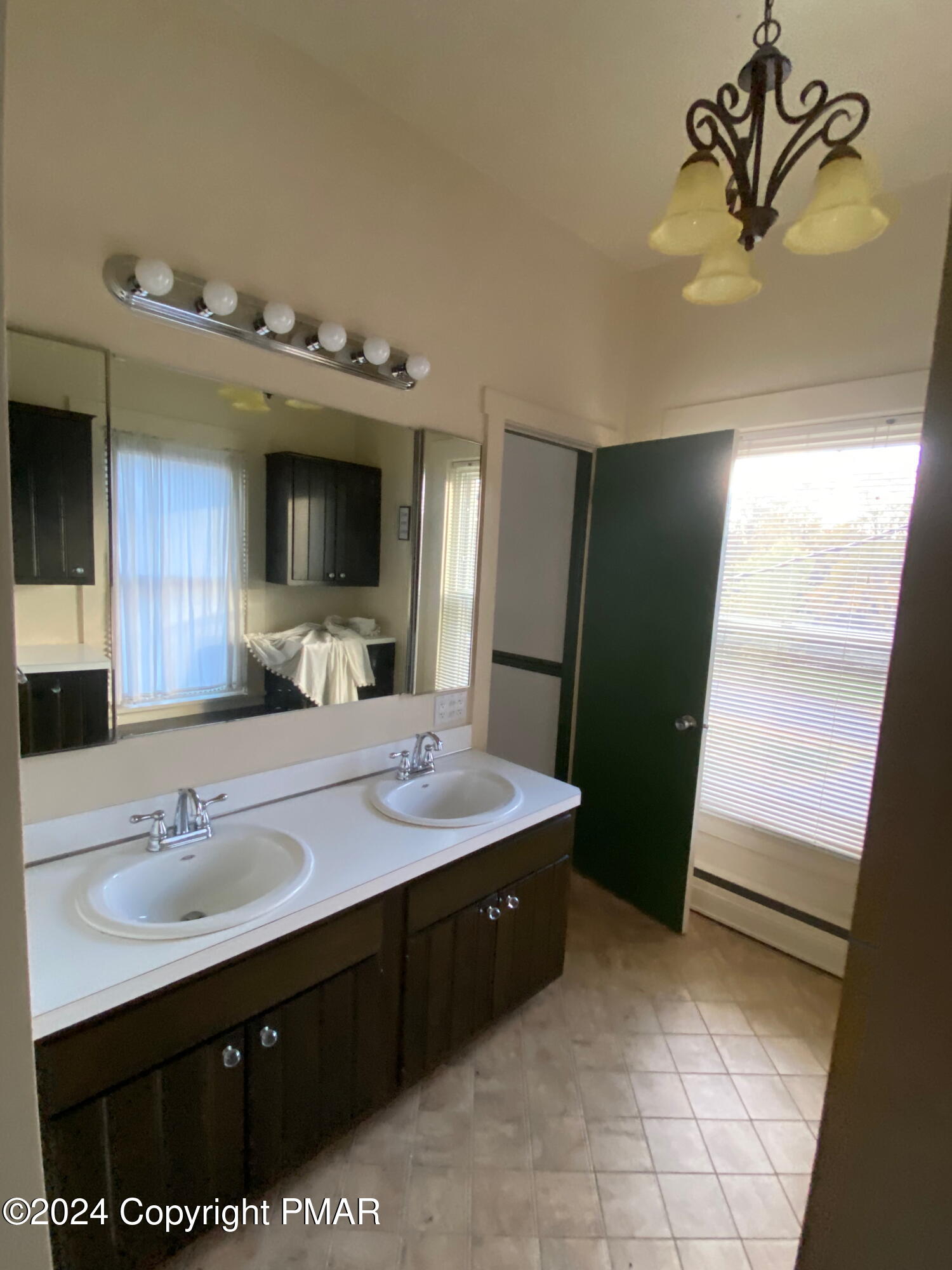 10491 River Road New Columbia, PA 17856 - Photo 66 of 72 a bathroom with a sink vanity and mirror