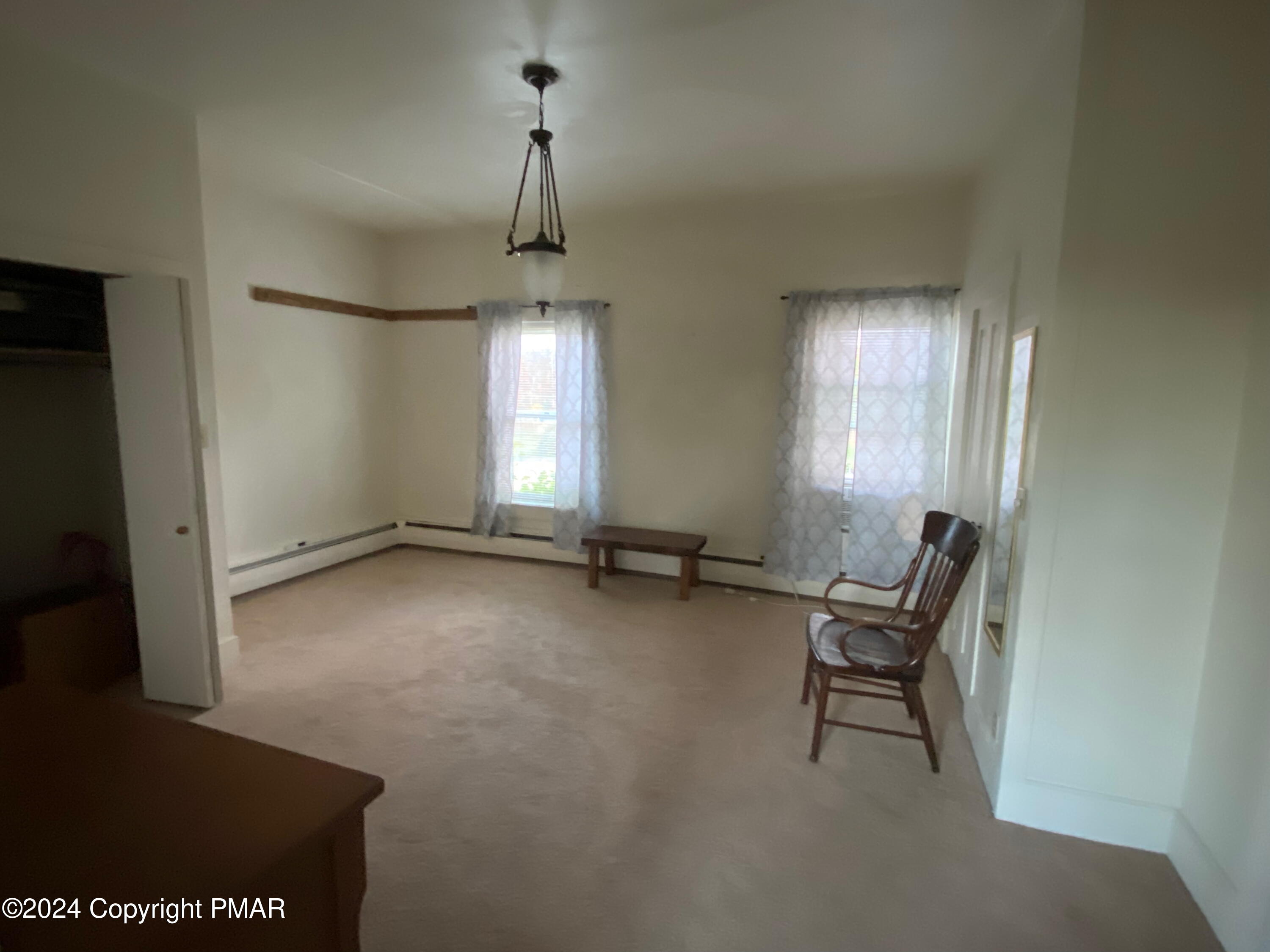 10491 River Road New Columbia, PA 17856 - Photo 69 of 72 a view of empty room with windows and piano