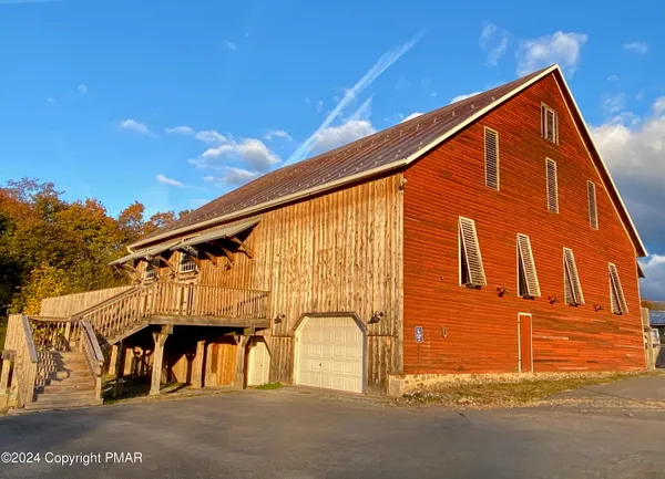 a view of deck with patio and wooden floor