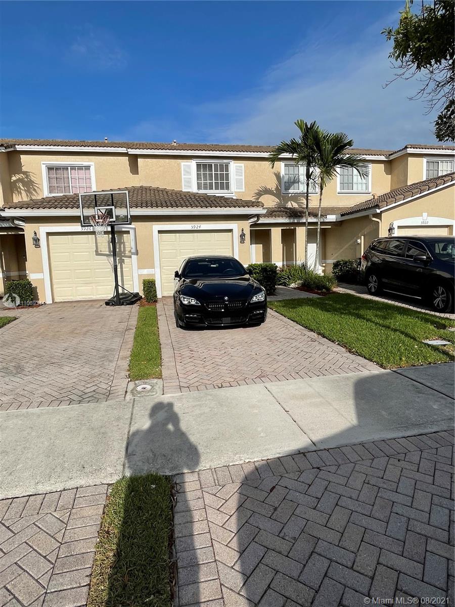 5924 Abbey Road Tamarac, FL 33321 - Photo 2 of 44 a view of a car park in front of a building