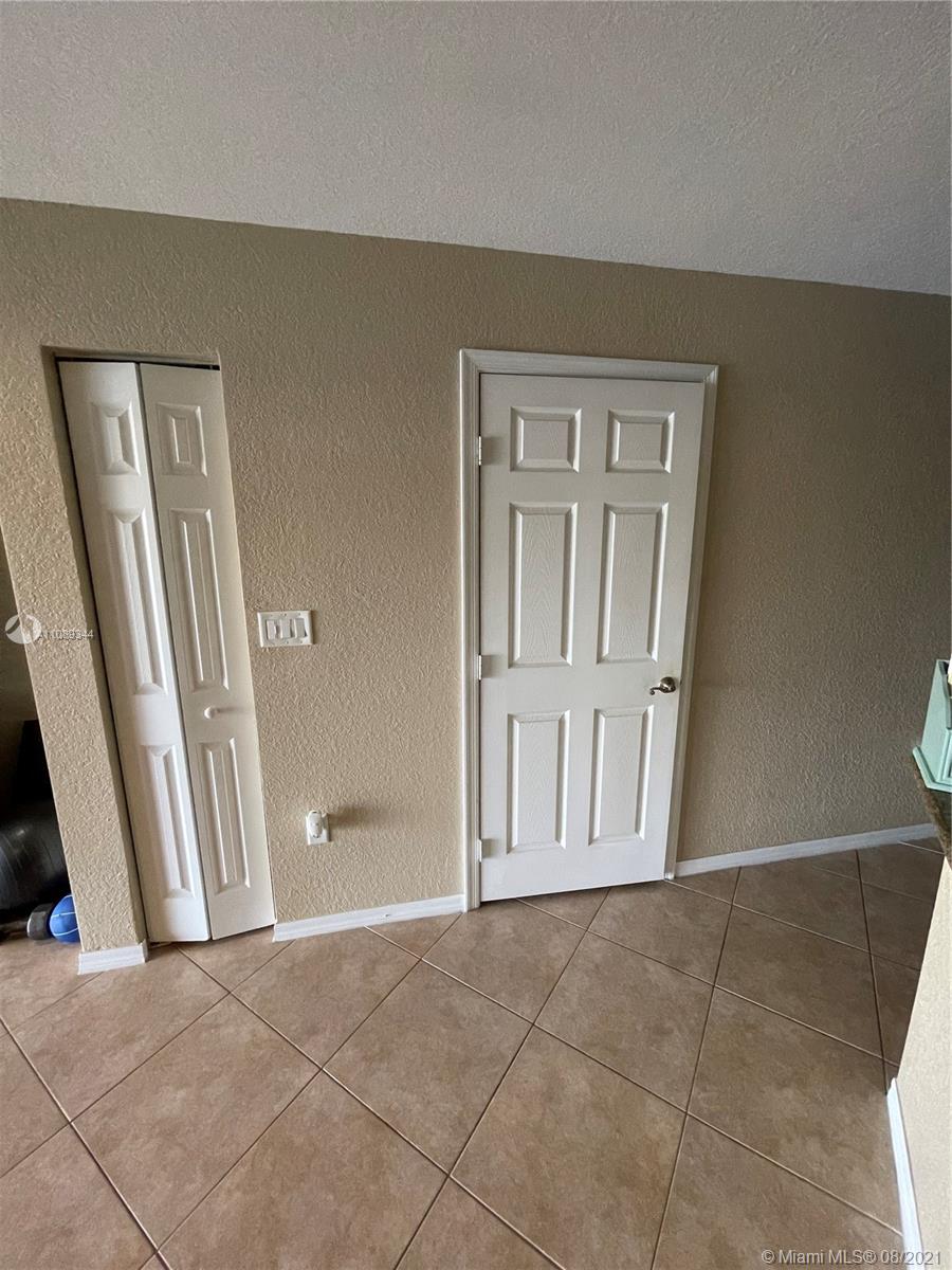 5924 Abbey Road Tamarac, FL 33321 - Photo 13 of 44 an empty room with windows
