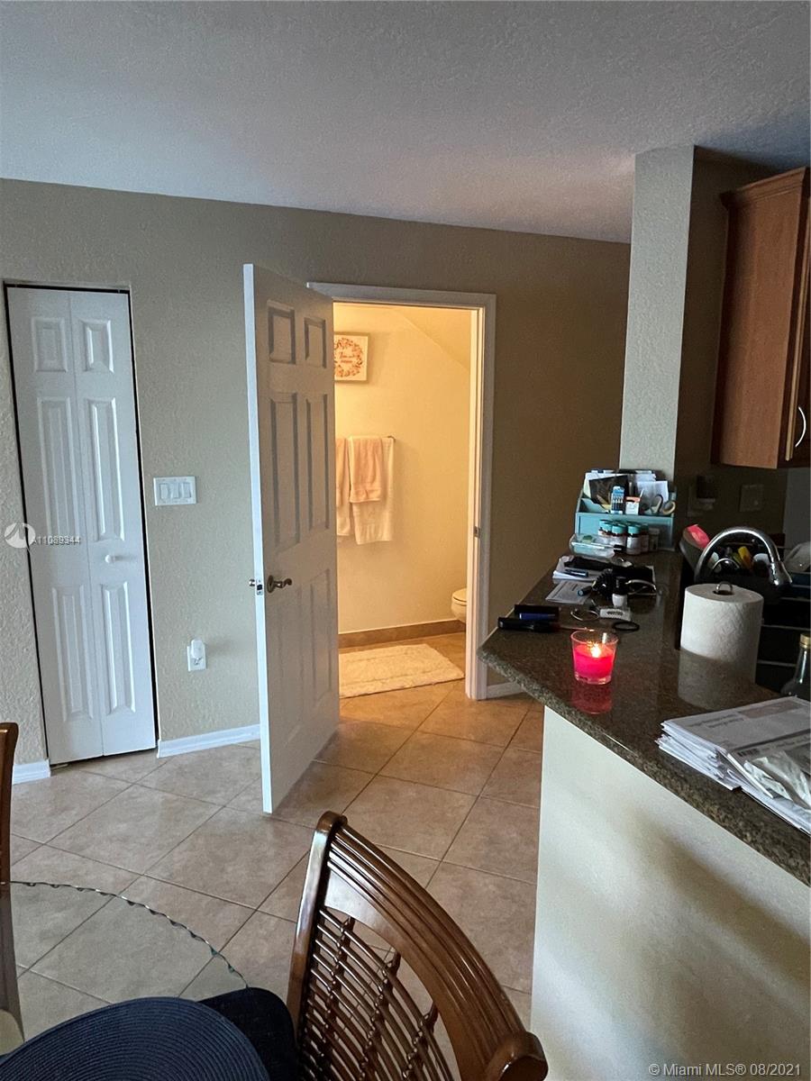 5924 Abbey Road Tamarac, FL 33321 - Photo 14 of 44 a bedroom with a bed and a dresser