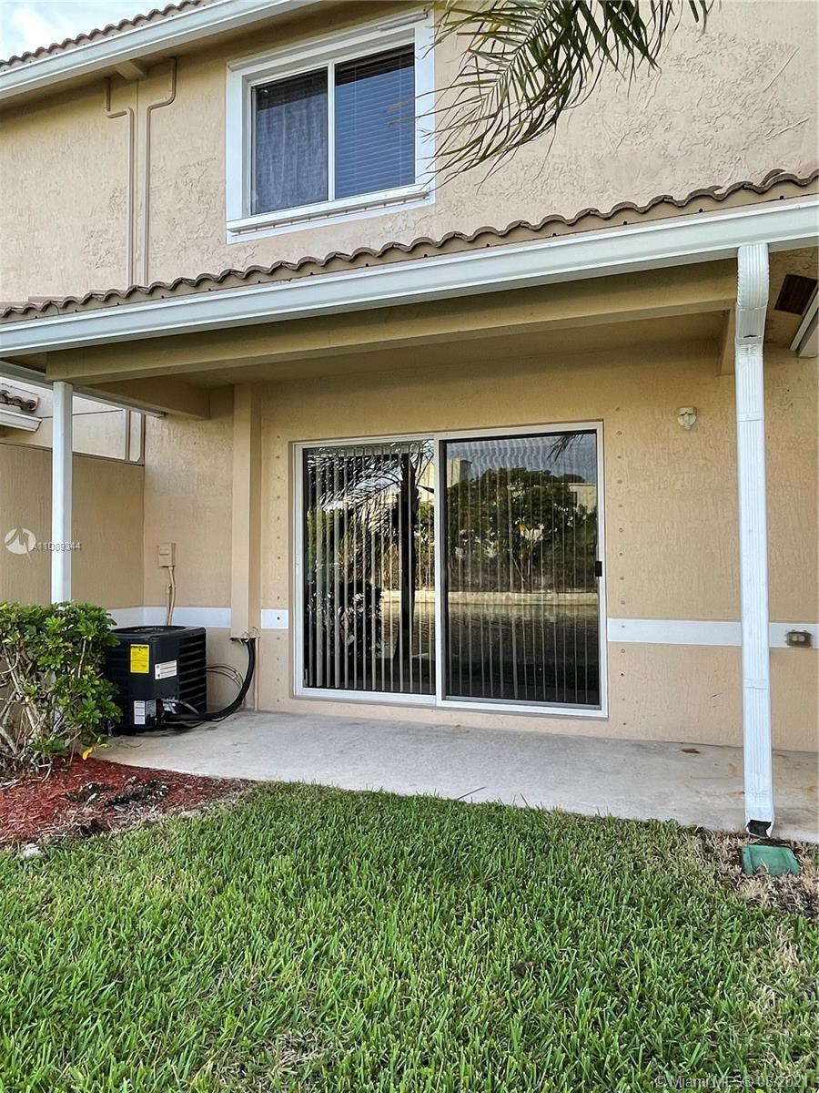 5924 Abbey Road Tamarac, FL 33321 - Photo 18 of 44 a view of a house with backyard and sitting area